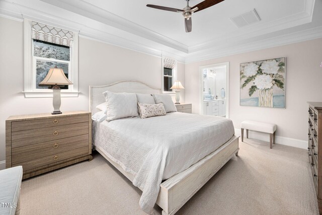 829 Churton Pl, Cary, NC 27518 - bedroom featuring light colored carpet, ornamental molding, baseboards, a tray ceiling, and ensuite bathroom