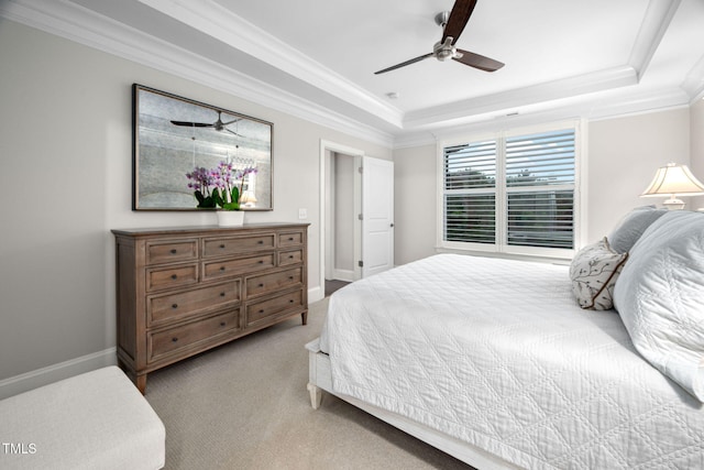 829 Churton Pl, Cary, NC 27518 - bedroom featuring a raised ceiling, light colored carpet, crown molding, a ceiling fan, and baseboards