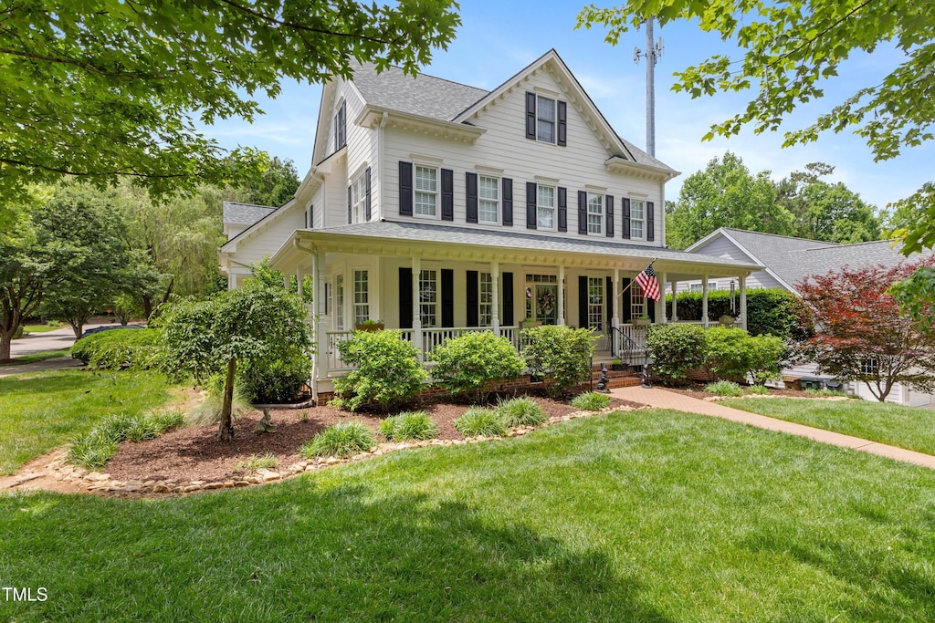 200 Cobblepoint Way, Holly Springs, NC 27540 - view of front of property featuring a porch, a front lawn, and roof with shingles