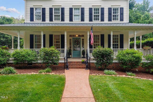 200 Cobblepoint Way, Holly Springs, NC 27540 - view of front facade featuring a porch and a front yard