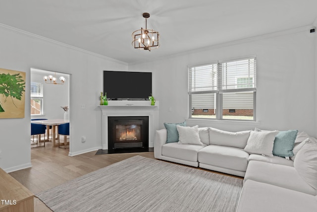 3204 Plaza Pl, Raleigh, NC 27612 - living room with a chandelier, crown molding, wood finished floors, and plenty of natural light