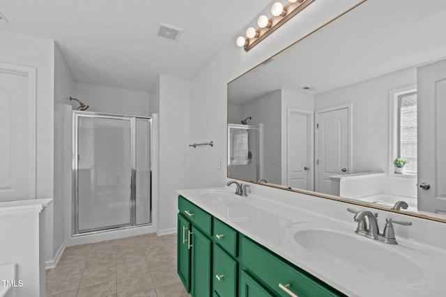 3204 Plaza Pl, Raleigh, NC 27612 - bathroom with a shower stall, double vanity, and tile patterned floors
