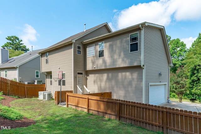 3204 Plaza Pl, Raleigh, NC 27612 - back of house with concrete driveway and a garage