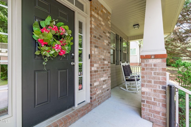 3204 Plaza Pl, Raleigh, NC 27612 - property entrance featuring covered porch and brick siding