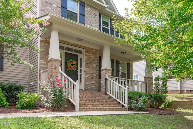 3204 Plaza Pl, Raleigh, NC 27612 - entrance to property with a porch and brick siding