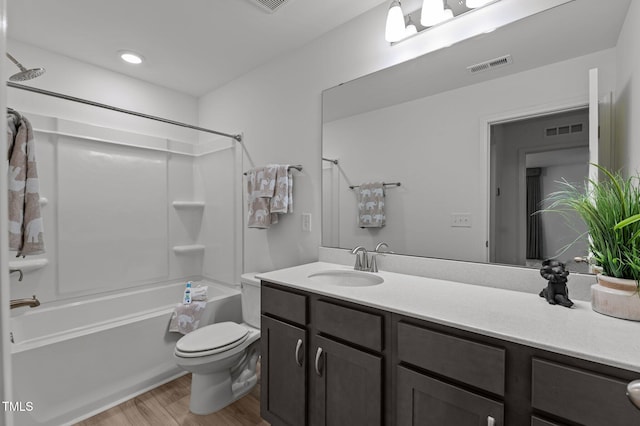 125 Shadowdale Ln, Rolesville, NC 27571 - full bathroom with wood finished floors, toilet, vanity, and bathing tub / shower combination