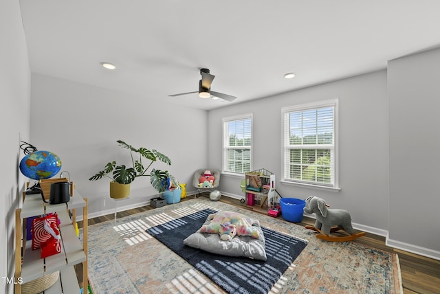 recreation room featuring a ceiling fan, baseboards, wood finished floors, and recessed lighting
