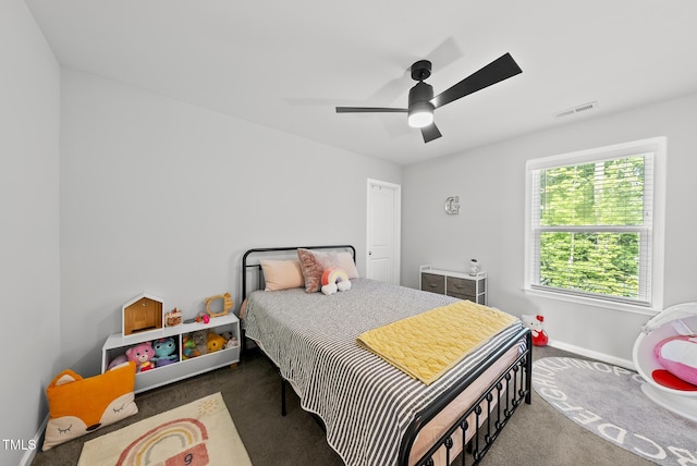 bedroom featuring carpet, baseboards, and a ceiling fan