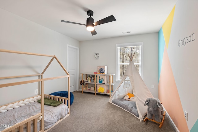 carpeted bedroom with ceiling fan