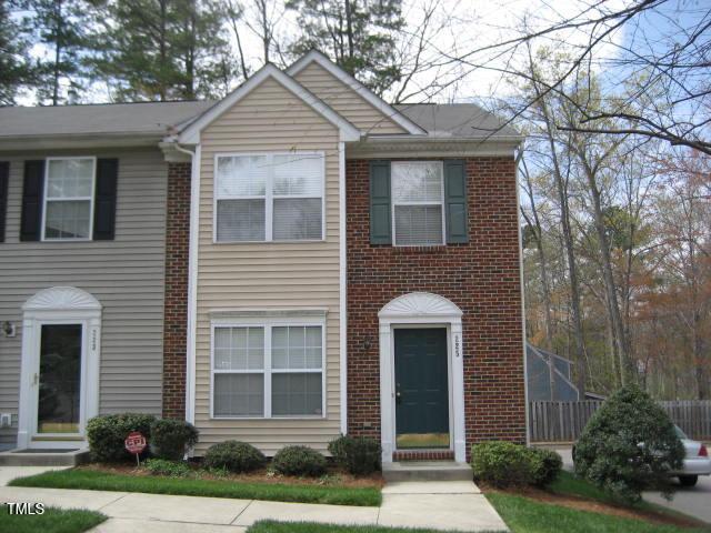 townhome / multi-family property with brick siding