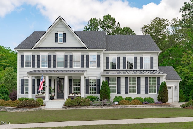 2711 Jordan Pointe Blvd, New Hill, NC 27562 - view of front facade featuring a standing seam roof, covered porch, a front yard, a shingled roof, and metal roof