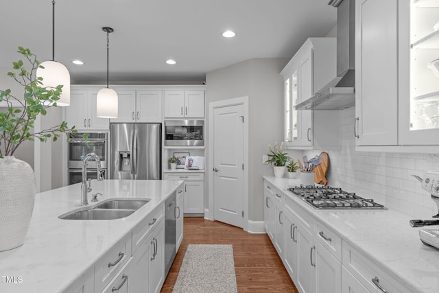2711 Jordan Pointe Blvd, New Hill, NC 27562 - kitchen featuring stainless steel appliances, a sink, wall chimney range hood, white cabinets, and glass insert cabinets