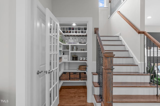 2711 Jordan Pointe Blvd, New Hill, NC 27562 - staircase featuring wood finished floors and french doors