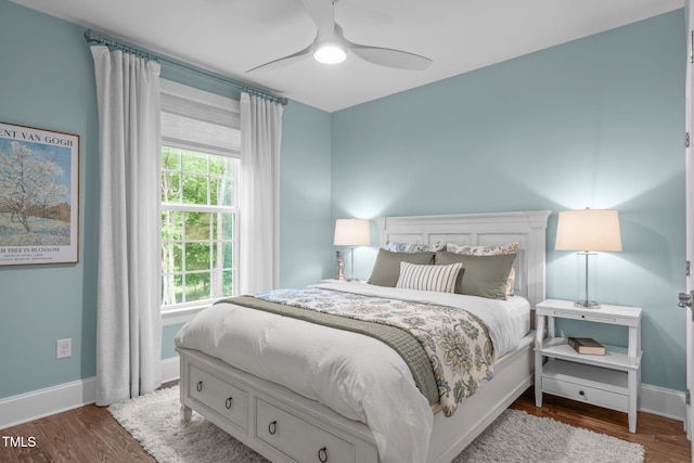 2711 Jordan Pointe Blvd, New Hill, NC 27562 - bedroom featuring baseboards, wood finished floors, and ceiling fan