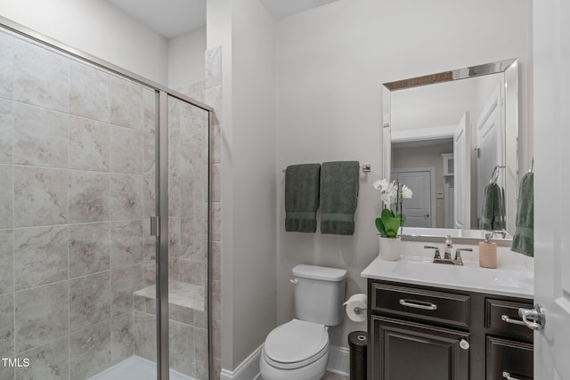 2711 Jordan Pointe Blvd, New Hill, NC 27562 - full bathroom featuring vanity, a stall shower, toilet, and baseboards