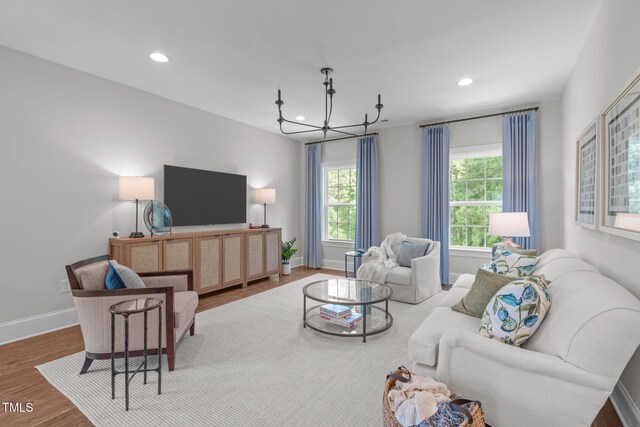 2711 Jordan Pointe Blvd, New Hill, NC 27562 - living room featuring a chandelier, wood finished floors, recessed lighting, and baseboards