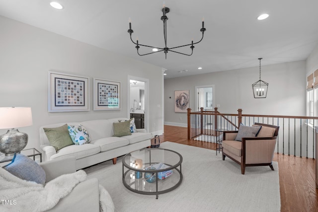 2711 Jordan Pointe Blvd, New Hill, NC 27562 - living area featuring a chandelier, wood finished floors, recessed lighting, and baseboards