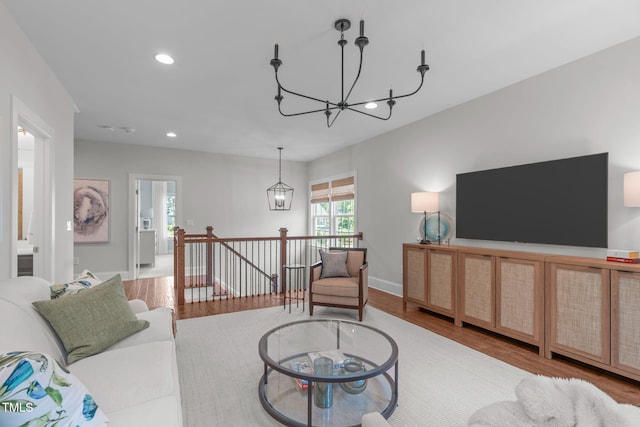 2711 Jordan Pointe Blvd, New Hill, NC 27562 - living room with a chandelier, wood finished floors, recessed lighting, and baseboards