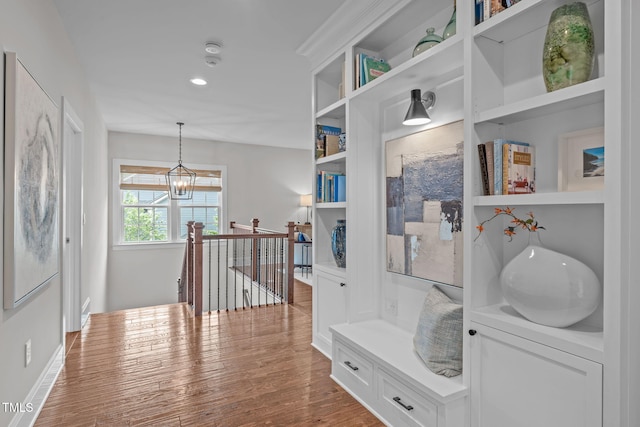 2711 Jordan Pointe Blvd, New Hill, NC 27562 - hallway featuring an upstairs landing, wood finished floors, a chandelier, and recessed lighting