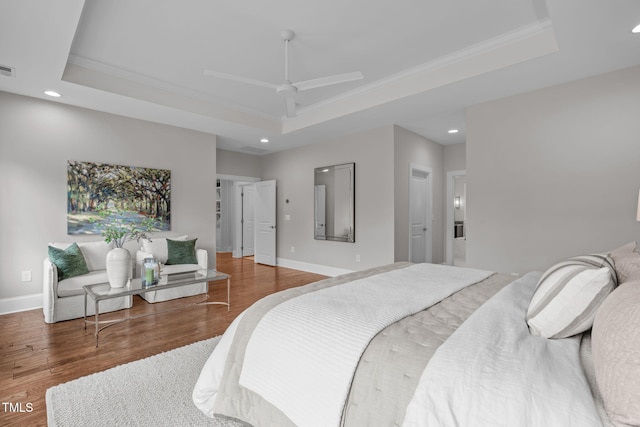 2711 Jordan Pointe Blvd, New Hill, NC 27562 - bedroom with a raised ceiling, recessed lighting, crown molding, wood finished floors, and baseboards