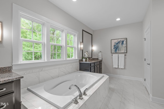 2711 Jordan Pointe Blvd, New Hill, NC 27562 - bathroom with vanity, healthy amount of natural light, a bath, marble finish floors, and recessed lighting