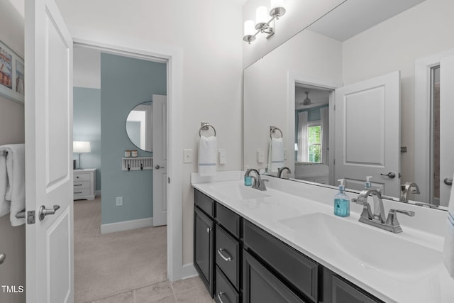 2711 Jordan Pointe Blvd, New Hill, NC 27562 - full bathroom featuring double vanity, ceiling fan, and baseboards
