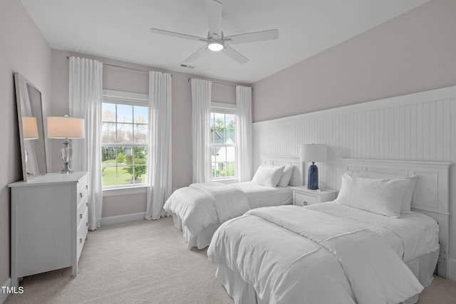 2711 Jordan Pointe Blvd, New Hill, NC 27562 - bedroom with light carpet, wainscoting, a ceiling fan, and baseboards