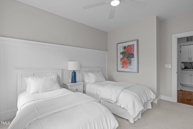 2711 Jordan Pointe Blvd, New Hill, NC 27562 - bedroom featuring light colored carpet, a ceiling fan, a sink, and baseboards