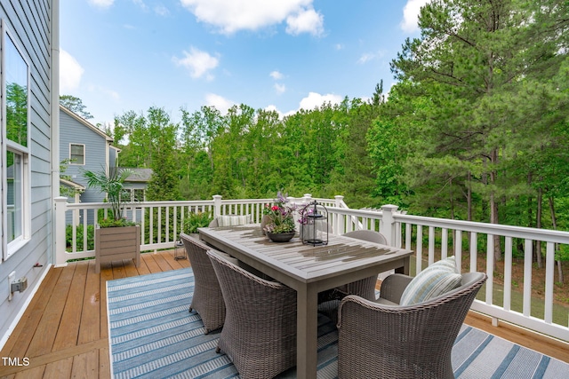 2711 Jordan Pointe Blvd, New Hill, NC 27562 - wooden deck featuring outdoor dining space