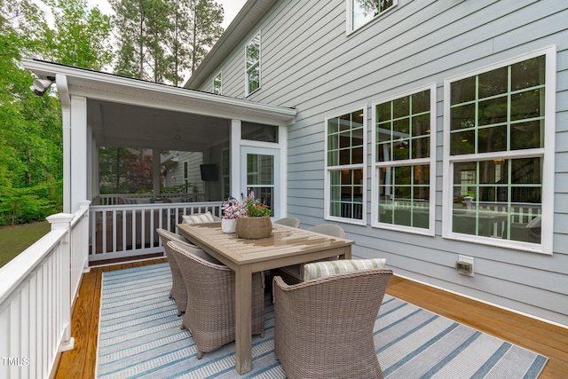 2711 Jordan Pointe Blvd, New Hill, NC 27562 - wooden terrace with a sunroom and outdoor dining area