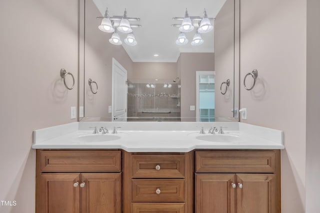 full bath with a stall shower, double vanity, and ornamental molding