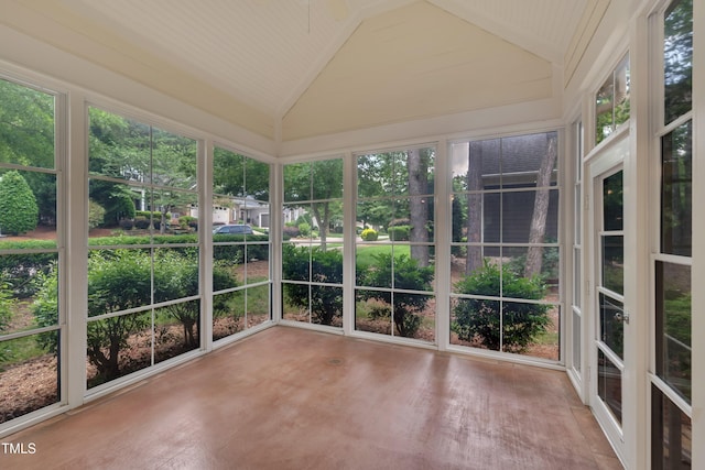 unfurnished sunroom featuring lofted ceiling