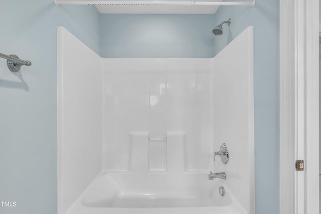 bathroom featuring washtub / shower combination