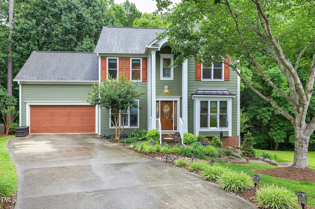 112 Hidden Bluff Ln, Cary, NC 27513 - view of front of house featuring a shingled roof and concrete driveway