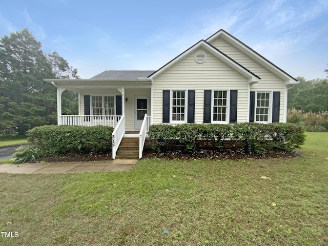 view of front of home with a porch and a front lawn
