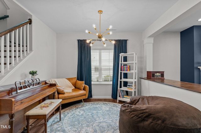 8925 Lee Brown Ridge Dr, Wake Forest, NC 27587 - living area with a chandelier, wood finished floors, stairs, and baseboards