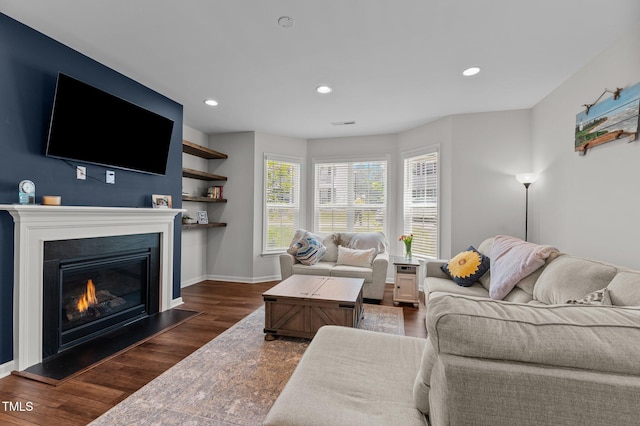 8925 Lee Brown Ridge Dr, Wake Forest, NC 27587 - living room with dark wood-style floors, a glass covered fireplace, baseboards, and recessed lighting