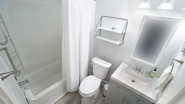 4613 Nesbit Ct, Raleigh, NC 27616 - bathroom with toilet, wood finished floors, shower / bathtub combination with curtain, and vanity