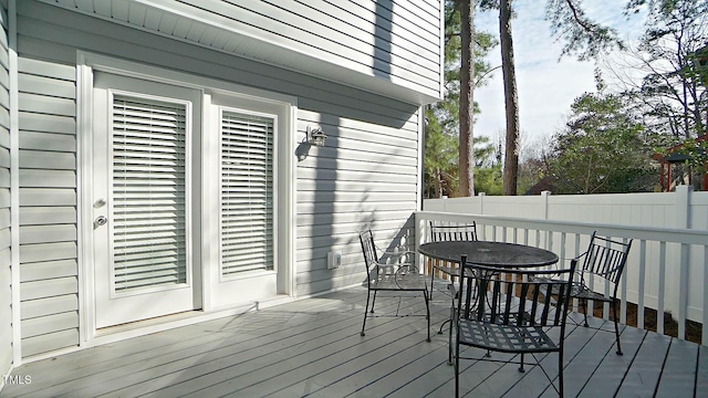 4613 Nesbit Ct, Raleigh, NC 27616 - deck with outdoor dining area and fence