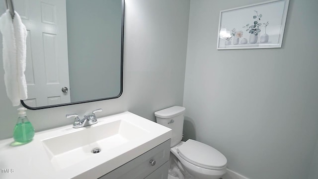 4613 Nesbit Ct, Raleigh, NC 27616 - bathroom with toilet, vanity, and baseboards