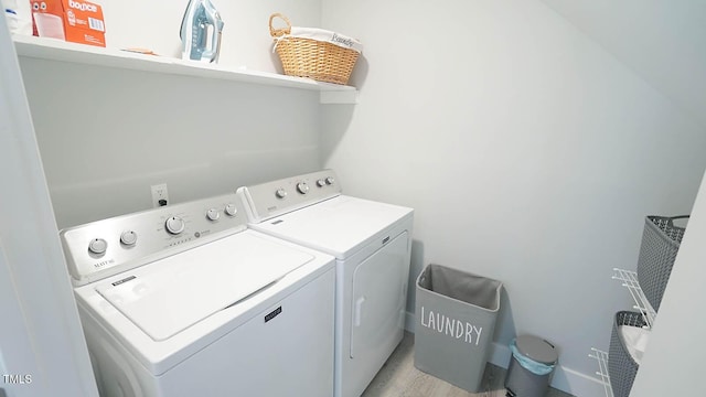 4613 Nesbit Ct, Raleigh, NC 27616 - laundry room featuring separate washer and dryer and light wood-style flooring