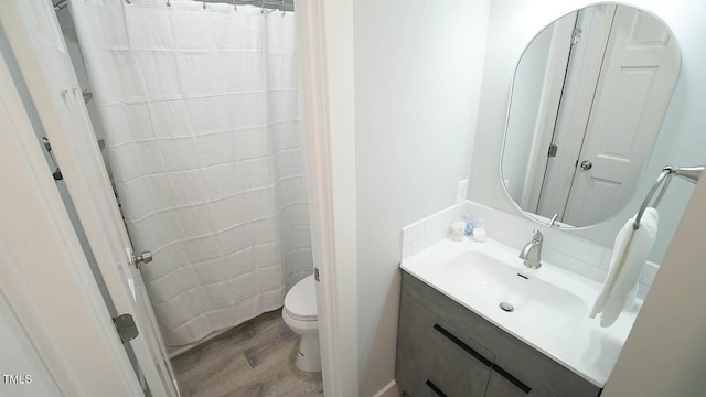 4613 Nesbit Ct, Raleigh, NC 27616 - bathroom featuring wood finished floors, toilet, vanity, and a shower with curtain