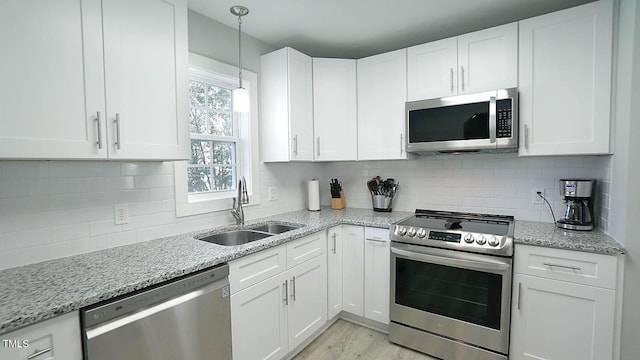 4613 Nesbit Ct, Raleigh, NC 27616 - kitchen featuring stainless steel appliances, a sink, and white cabinetry