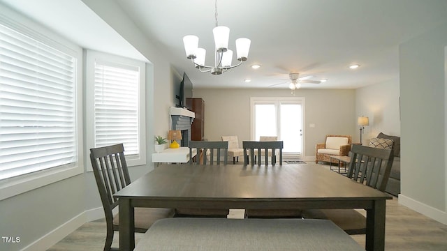 4613 Nesbit Ct, Raleigh, NC 27616 - dining area featuring light wood-style flooring, baseboards, a chandelier, recessed lighting, and ceiling fan