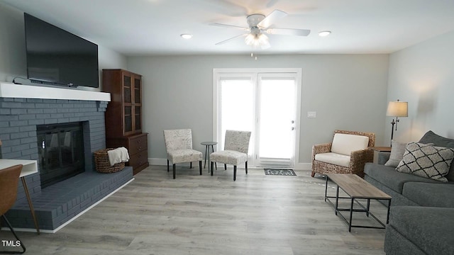 4613 Nesbit Ct, Raleigh, NC 27616 - living room featuring a ceiling fan, a fireplace, light wood finished floors, baseboards, and recessed lighting