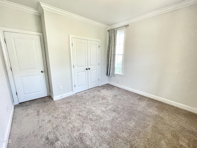 8813 Moss Glen Dr, Raleigh, NC 27617 - unfurnished bedroom with crown molding, carpet, baseboards, and a closet