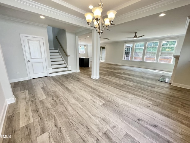 8813 Moss Glen Dr, Raleigh, NC 27617 - unfurnished living room featuring a chandelier, ornamental molding, hardwood / wood-style flooring, ceiling fan, and stairway