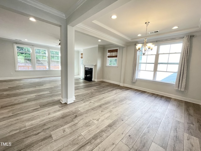 8813 Moss Glen Dr, Raleigh, NC 27617 - unfurnished living room with ornamental molding, wood finished floors, a chandelier, a fireplace, and baseboards