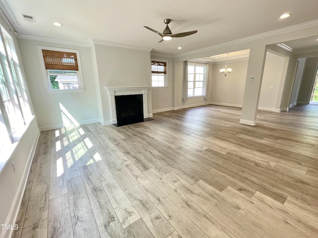 8813 Moss Glen Dr, Raleigh, NC 27617 - unfurnished living room with ornamental molding, ceiling fan, light wood-style flooring, a chandelier, and baseboards