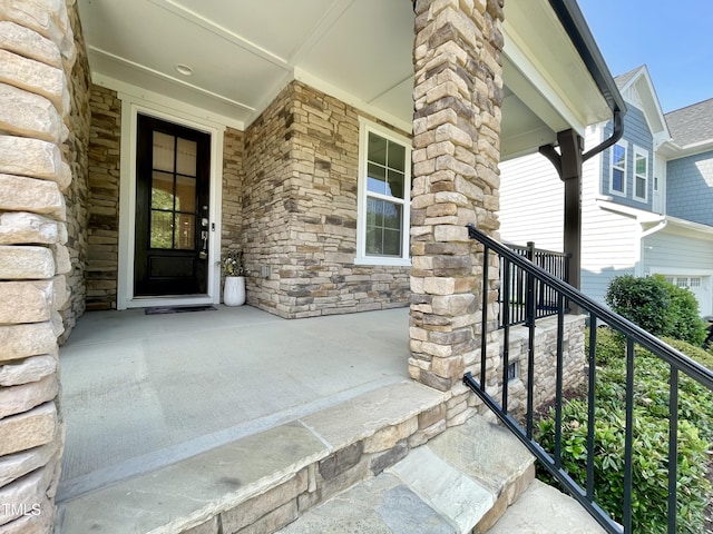 8813 Moss Glen Dr, Raleigh, NC 27617 - entrance to property with covered porch and stone siding
